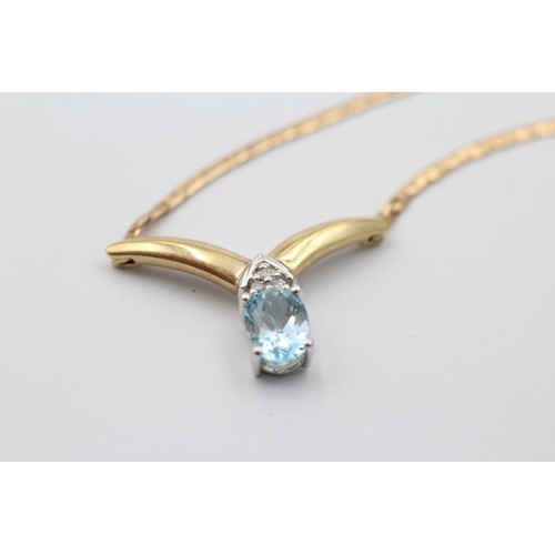 1130 - A 9ct gold diamond and topaz V-shape pendant necklace - approx. gross weight 5.9 grams