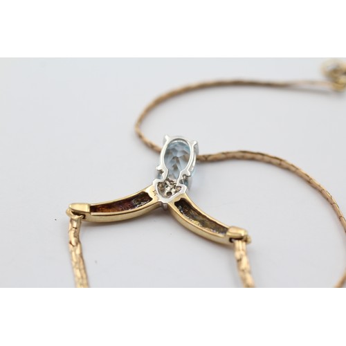 1130 - A 9ct gold diamond and topaz V-shape pendant necklace - approx. gross weight 5.9 grams