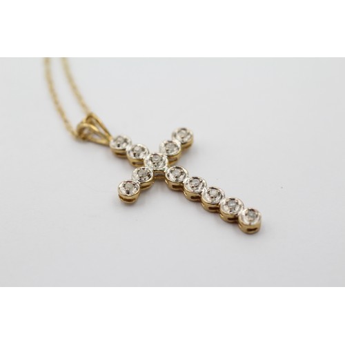 1131 - A 9ct gold diamond cross pendant necklace - approx. gross weight 2 grams and 23cm long