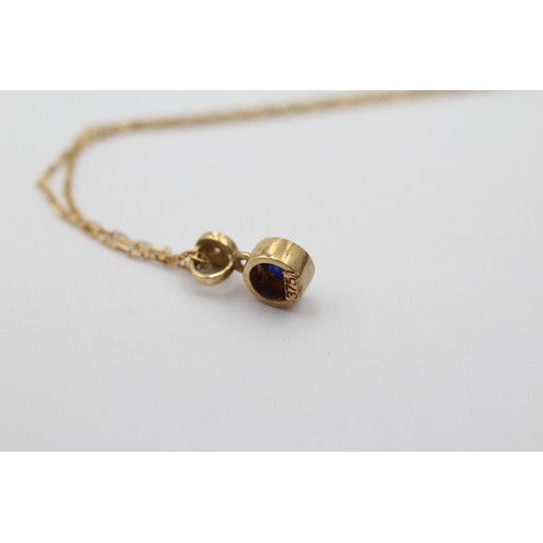 1132 - A 9ct gold diamond and sapphire pendant necklace - approx. gross weight 1.4 grams