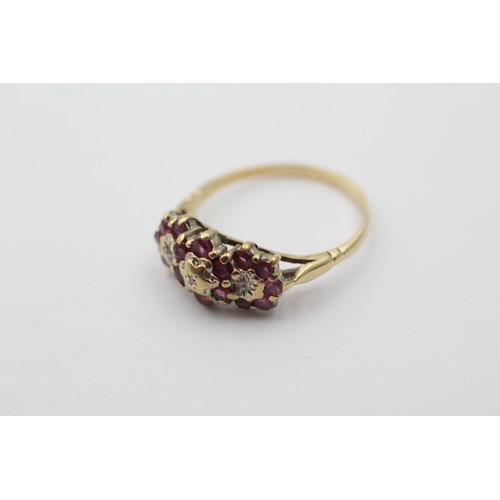 1134 - A 9ct gold diamond and ruby dress ring, size P - approx. gross weight 2.5 grams