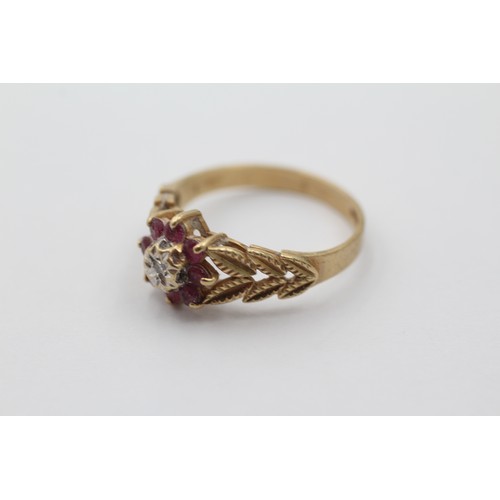 1144 - A 9ct gold diamond and ruby halo ring with foliate shank, size P½ - approx. gross weight 2.7 grams