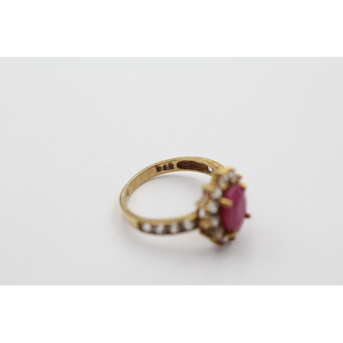 1147 - A 9ct gold ruby and clear gemstone halo ring with clear gemstone set shank, size L - approx. gross w... 