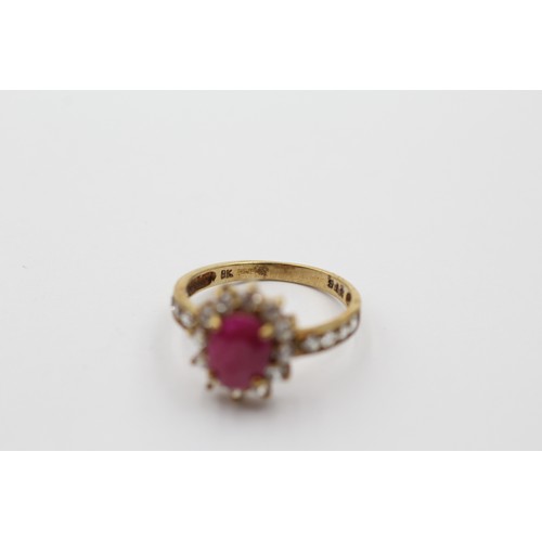 1147 - A 9ct gold ruby and clear gemstone halo ring with clear gemstone set shank, size L - approx. gross w... 