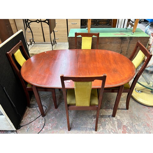 63 - A mahogany extending dining table and four matching chairs