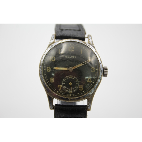 1233 - A WWII era Helios DH German Army issued mechanical wristwatch, caseback engraved 'D 40228 H'