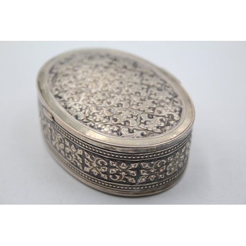 1305 - An .800 silver oval snuff box - approx. gross weight 71 grams and 8cm diameter