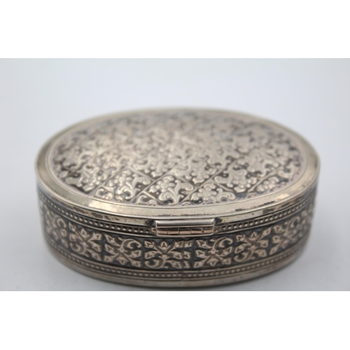 1305 - An .800 silver oval snuff box - approx. gross weight 71 grams and 8cm diameter