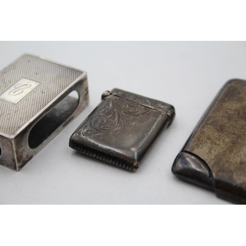 1310 - Three pieces of hallmarked sterling silver, one business card holder, one vesta case and one matchbo... 