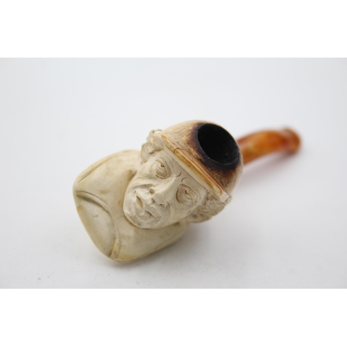 1369 - Two antique estate smoking pipes to include one with silver mount etc.