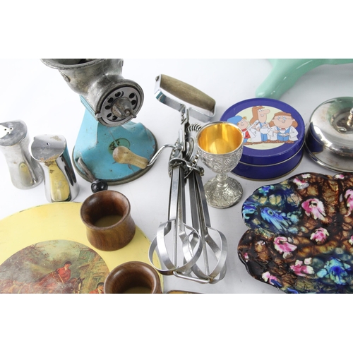 261 - A collection of vintage kitchenware to include meat grinder, whisk, Picquot ware etc.