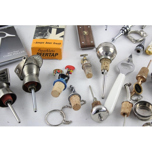 549 - A collection of breweriana to include stein, bottle stopper, spirit measure etc.