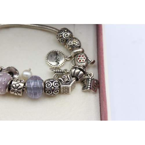 1152 - A Pandora .925 silver bracelet with charms - approx. gross weight 60 grams