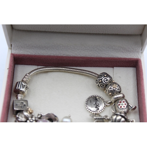 1152 - A Pandora .925 silver bracelet with charms - approx. gross weight 60 grams