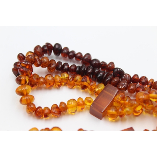 1161 - Two amber beaded necklaces - approx. gross weight 49 grams