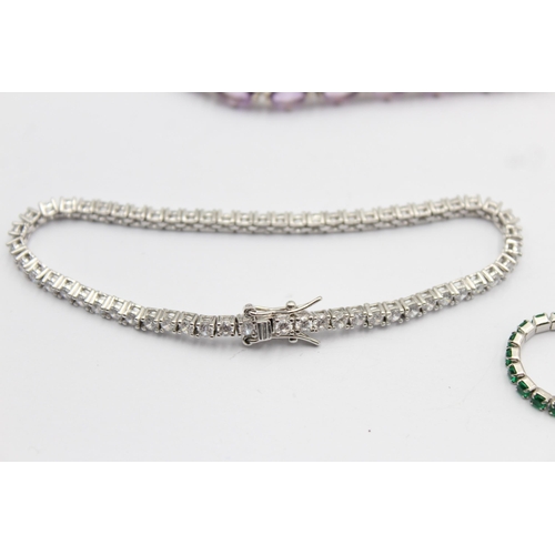 1163 - Four .925 silver tennis bracelets to include emerald etc. - approx. gross weight 38 grams