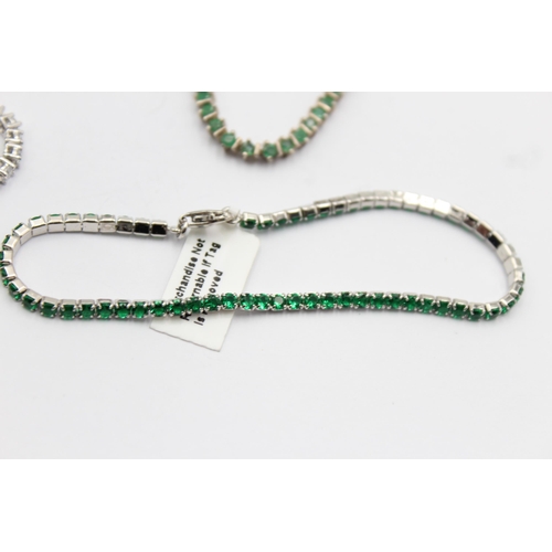 1163 - Four .925 silver tennis bracelets to include emerald etc. - approx. gross weight 38 grams