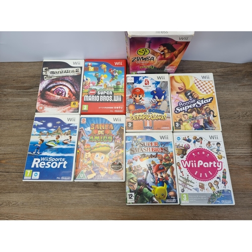 596A - Nine Nintendo Wii games with Nintendo DS hand held games console