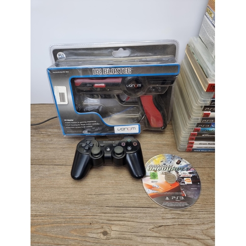 597 - A Sony PlayStation 3 CECHC03 games console with controller, PlayStation Eye camera and sixteen games