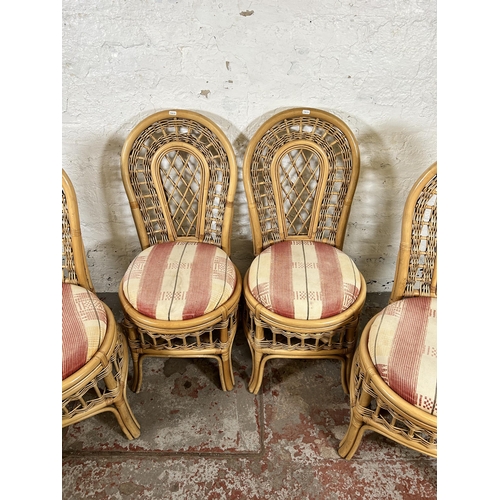 146 - Four cane dining chairs