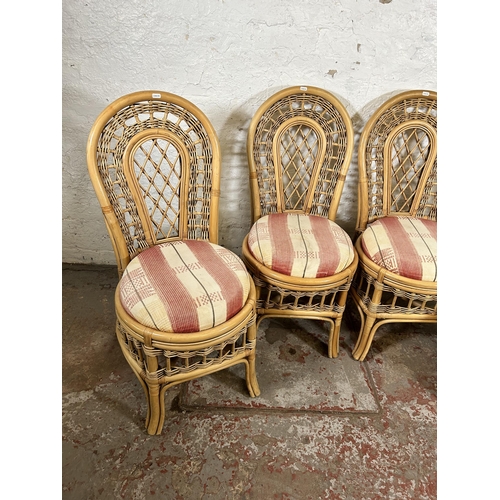 146 - Four cane dining chairs