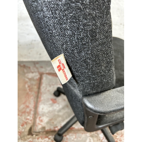 152 - A modern grey fabric upholstered swivel office desk chair