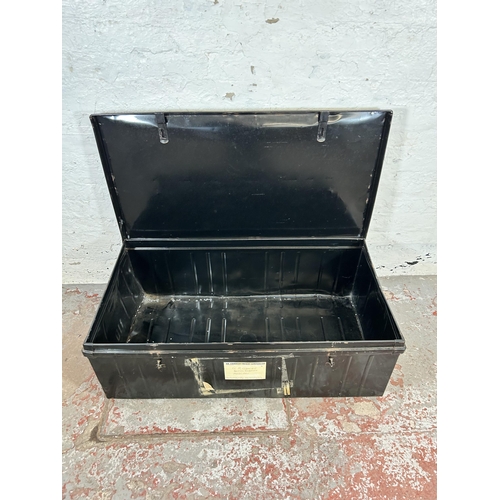 153 - A vintage black metal travel trunk