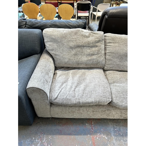 164 - A modern fabric upholstered two seater sofa