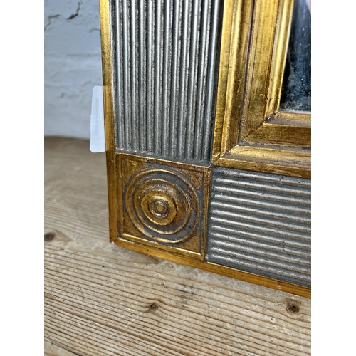 176 - A modern gilt framed bevelled edge wall mirror - approx. 68cm high x 94cm wide