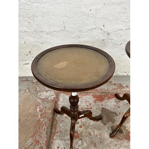 103 - A pair of 19th century style mahogany and tan leather circular tripod wine tables