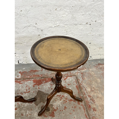 103 - A pair of 19th century style mahogany and tan leather circular tripod wine tables