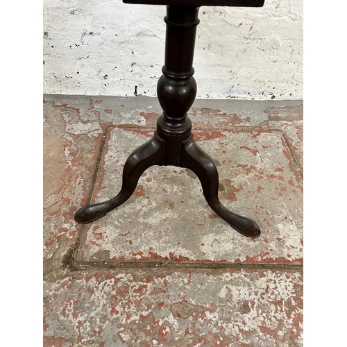 104 - A George III mahogany oval tilt top occasional table on tripod pedestal support