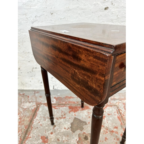 106 - A Regency mahogany drop leaf Pembroke table