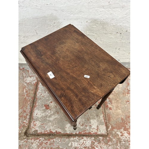 106 - A Regency mahogany drop leaf Pembroke table