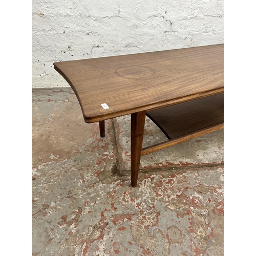 110 - A mid 20th century teak rectangular two tier coffee table