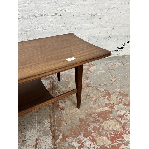 110 - A mid 20th century teak rectangular two tier coffee table