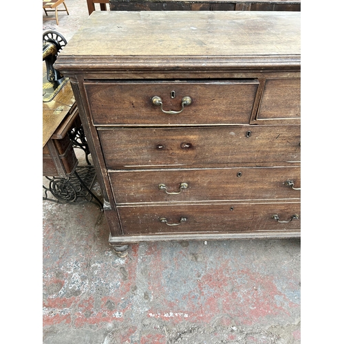 115 - A George III mahogany chest of two short over three long drawers