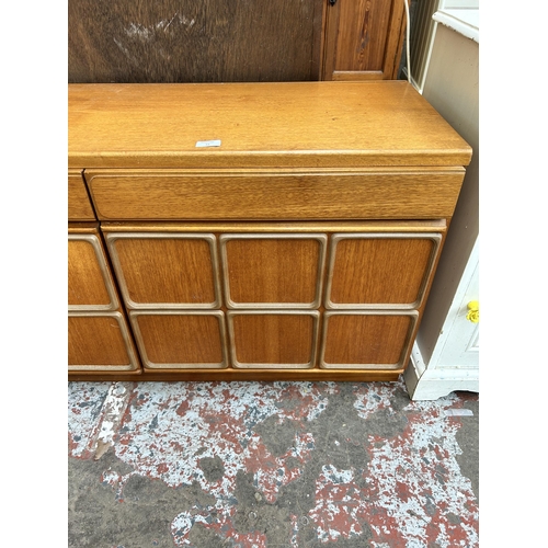 12 - A McIntosh teak sideboard with three drawers and three cupboard doors