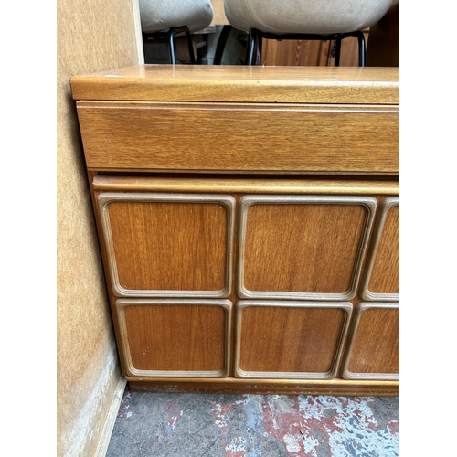 12 - A McIntosh teak sideboard with three drawers and three cupboard doors