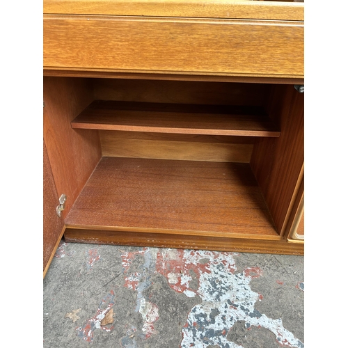 12 - A McIntosh teak sideboard with three drawers and three cupboard doors