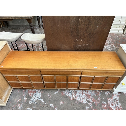 12 - A McIntosh teak sideboard with three drawers and three cupboard doors