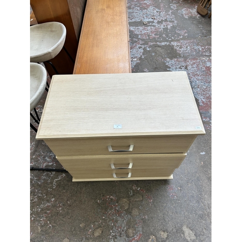 13 - A modern oak effect chest of three drawers