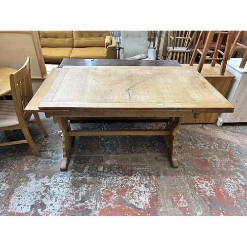 16 - An oak rectangular extending dining table - approx. 137cm long x 198cm extended x 84cm wide x 78cm h... 