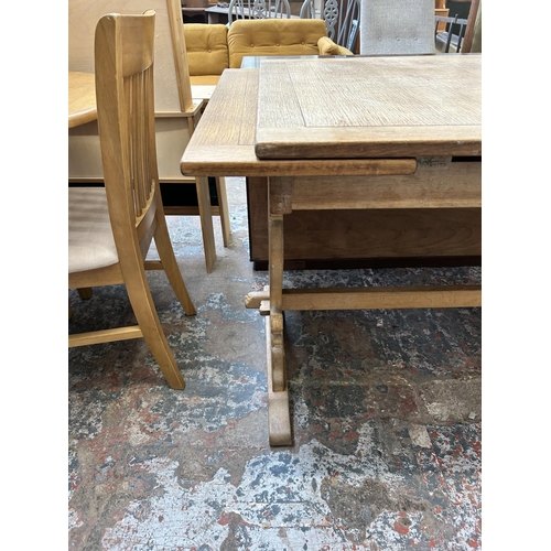 16 - An oak rectangular extending dining table - approx. 137cm long x 198cm extended x 84cm wide x 78cm h... 