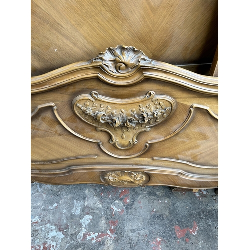 26 - A French carved walnut king size bed frame