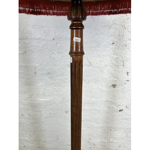 31 - A mid 20th century beech standard lamp with reeded column and circular base - approx. 180cm high