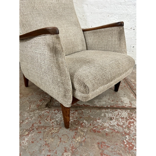 32 - A 1960s teak and fabric upholstered rocking armchair, stamped Norsk Pat. NR. 96981 - approx. 100cm h... 