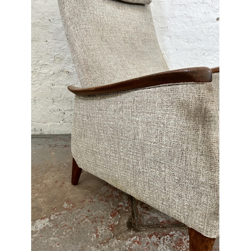 32 - A 1960s teak and fabric upholstered rocking armchair, stamped Norsk Pat. NR. 96981 - approx. 100cm h... 