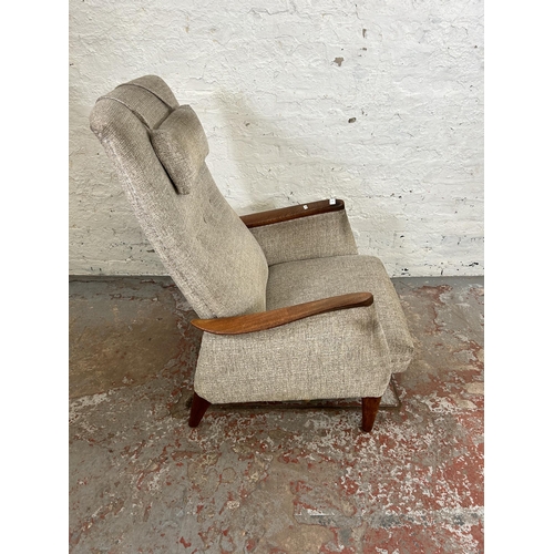 32 - A 1960s teak and fabric upholstered rocking armchair, stamped Norsk Pat. NR. 96981 - approx. 100cm h... 