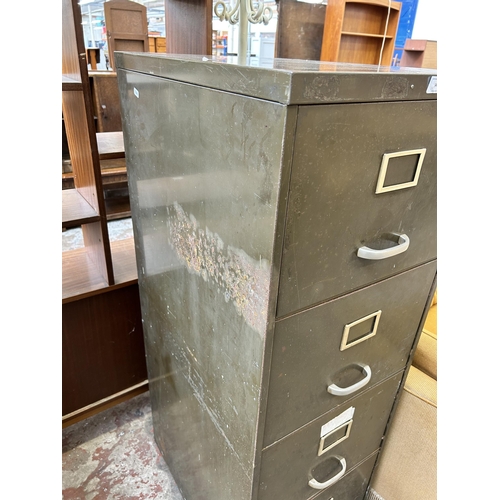 34 - A military green metal four drawer office filing cabinet - approx. 132cm high x 45cm wide x 62cm dee... 